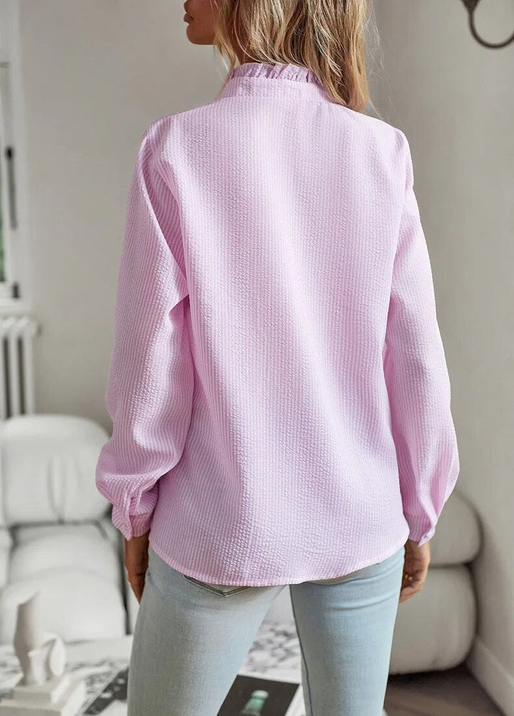 Four color options of the Sheri pleated blouse — blue, white, gray, and pink — displayed together