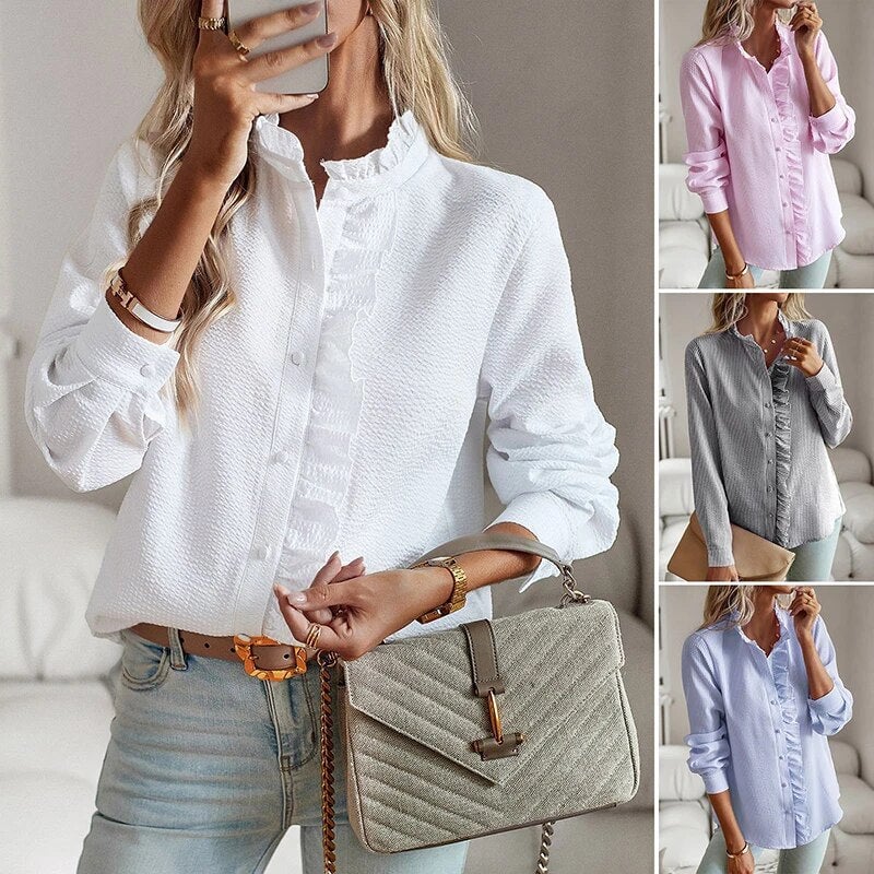 Woman smiling confidently in the Sheri long-sleeve pleated blouse in a casual everyday setting