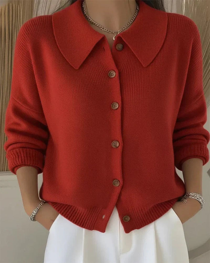 Close-up of button collar cardigan showing structured neckline and elegant button detail