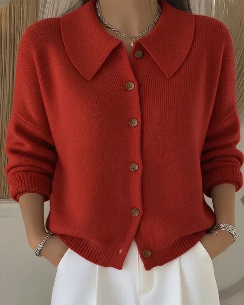 Close-up of button collar cardigan showing structured neckline and elegant button detail