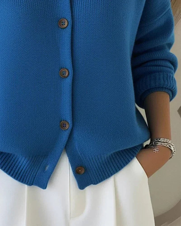 Model wearing button collar cardigan paired with jeans for a casual chic look