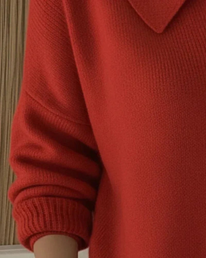 Detail shot of soft knit fabric and button-up collar on women's cardigan