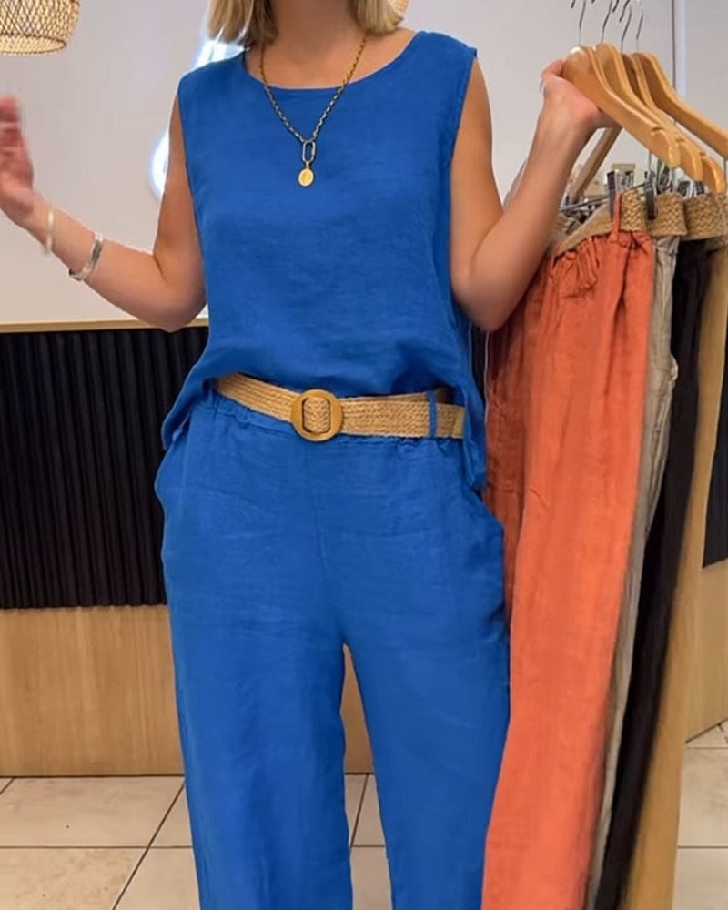 Lifestyle flat lay of the Sienna top and wide-leg pants set with coordinating summer accessories