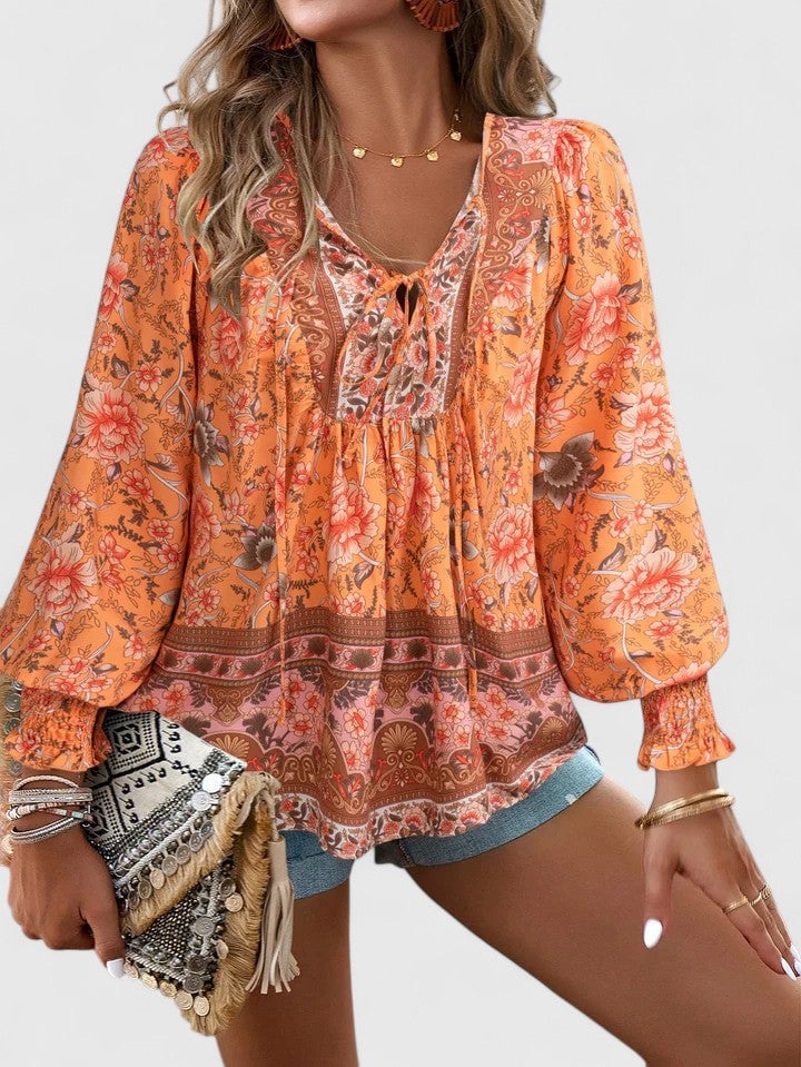 Back view of the Sienna floral boho blouse in pink with all-over botanical print
