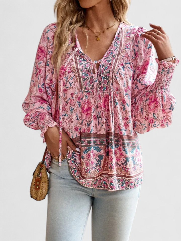 Front view of the Sienna floral boho blouse in blue with puff sleeves