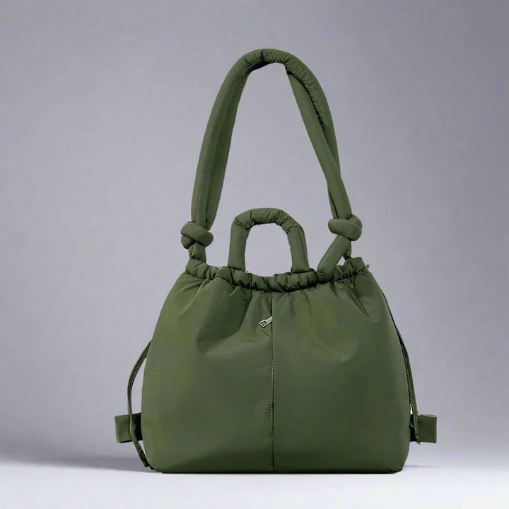 Side view of the Sienna quilted puffer tote bag in Black