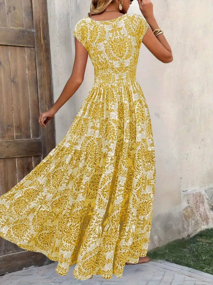 Back view of the Sienna smocked boho maxi dress showing the tiered skirt layers