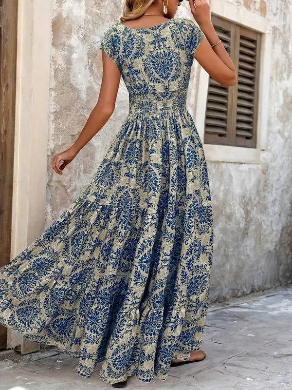Lifestyle shot of the Sienna smocked maxi dress worn outdoors in a warm-weather setting