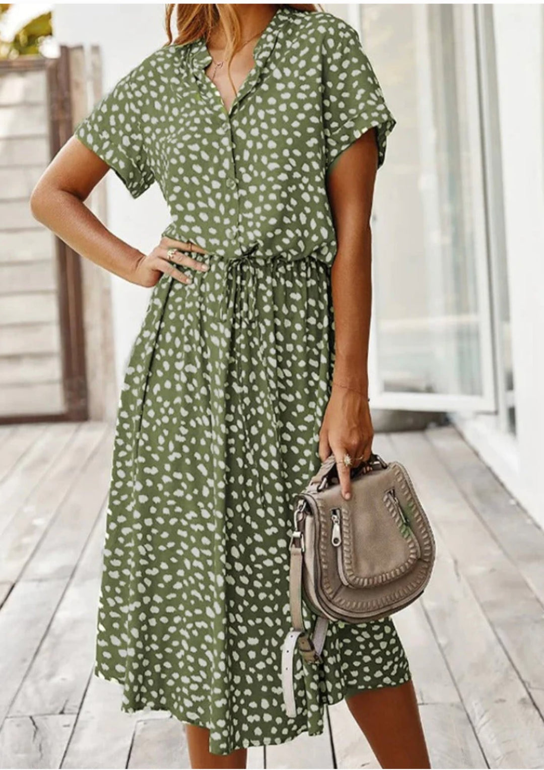 Sienna spotted midi dress in beige showing partial button placket and notched collar detail, close-up front
