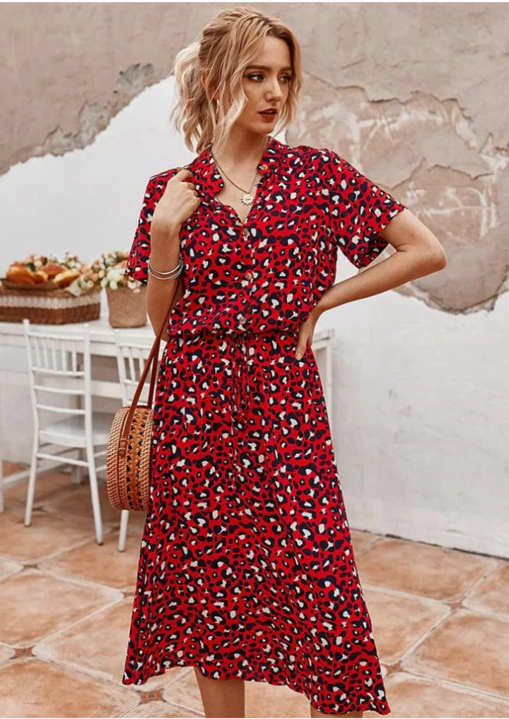 Women's button-down spotted midi dress in black, front view on model