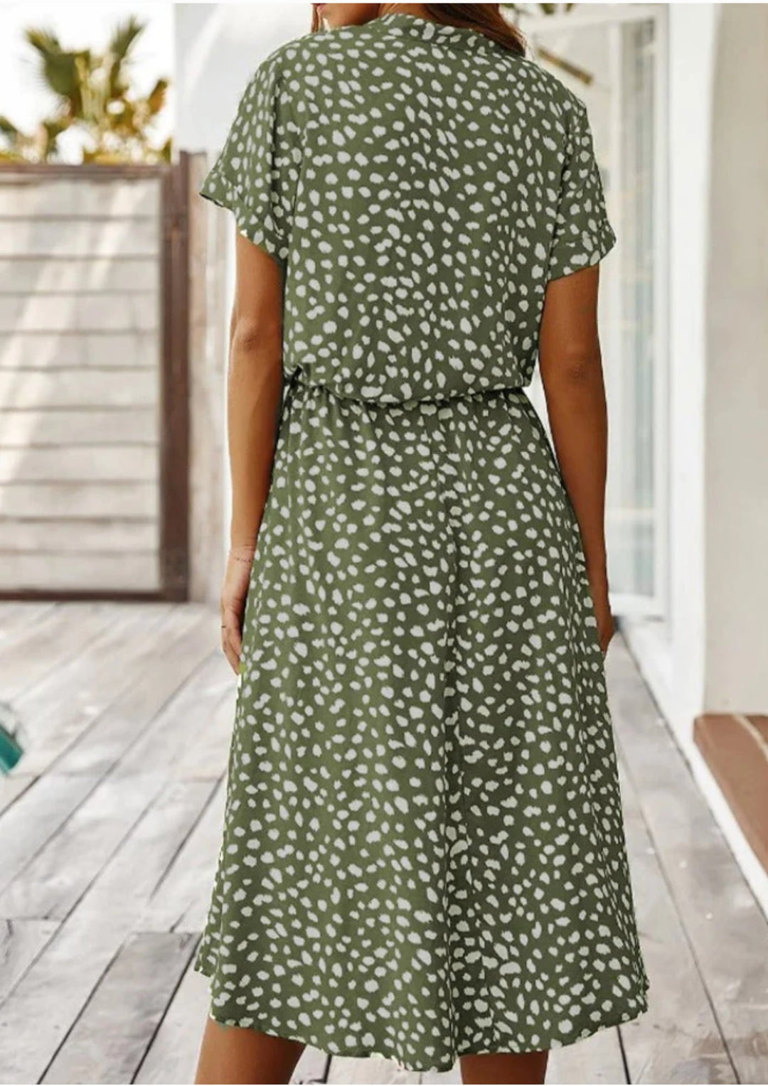Model wearing Sienna spotted print button-down midi dress in red, front view