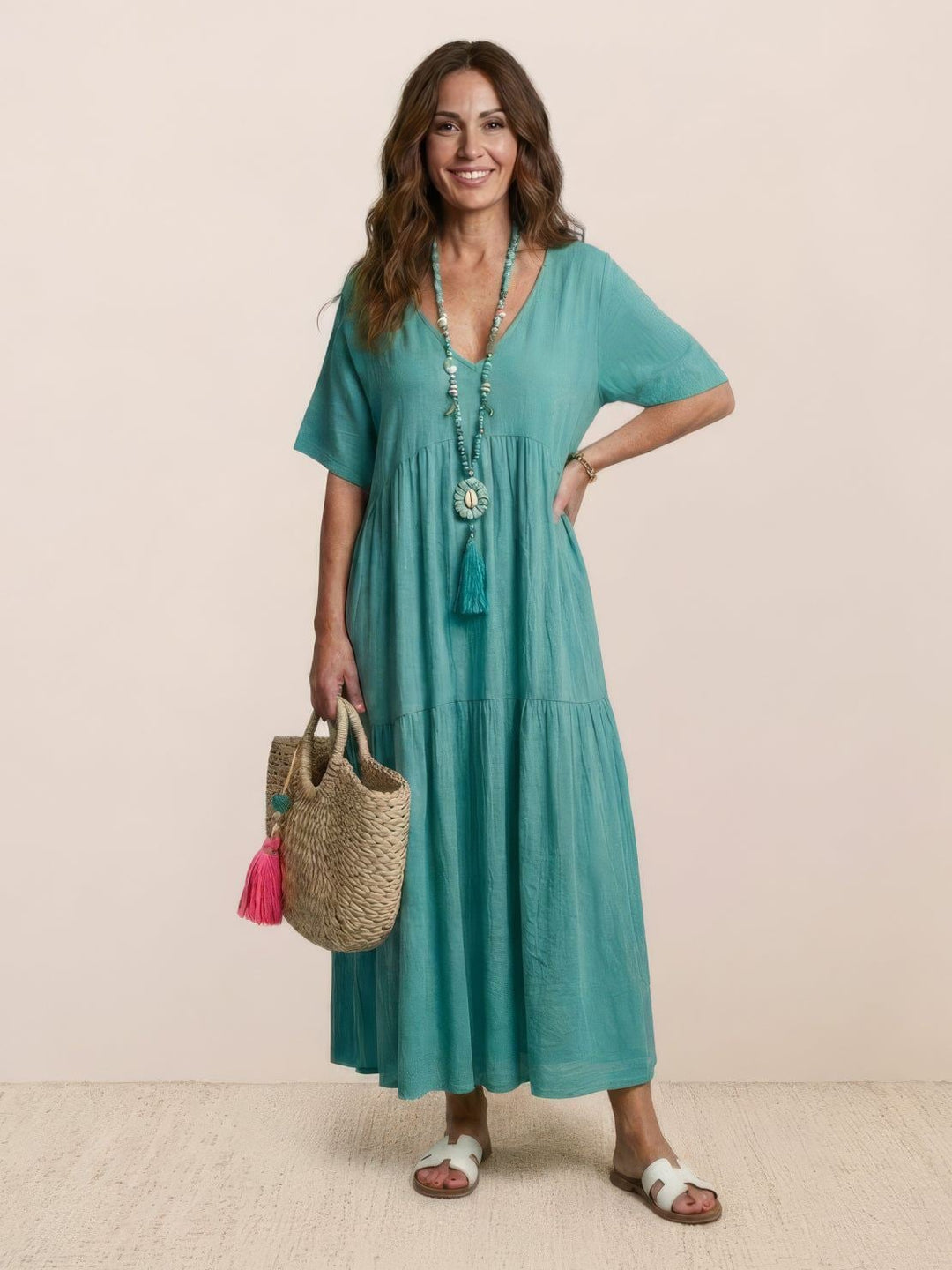 Back view of Sienna maxi dress in army green with flowing tiered skirt