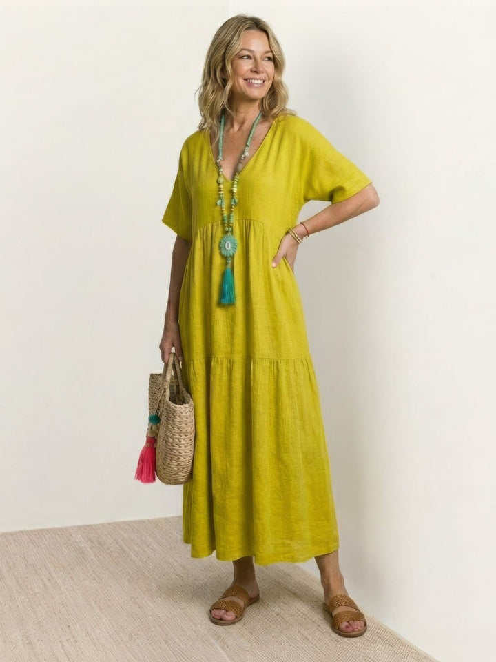 Close-up of tiered skirt layers on Sienna maxi dress in army green