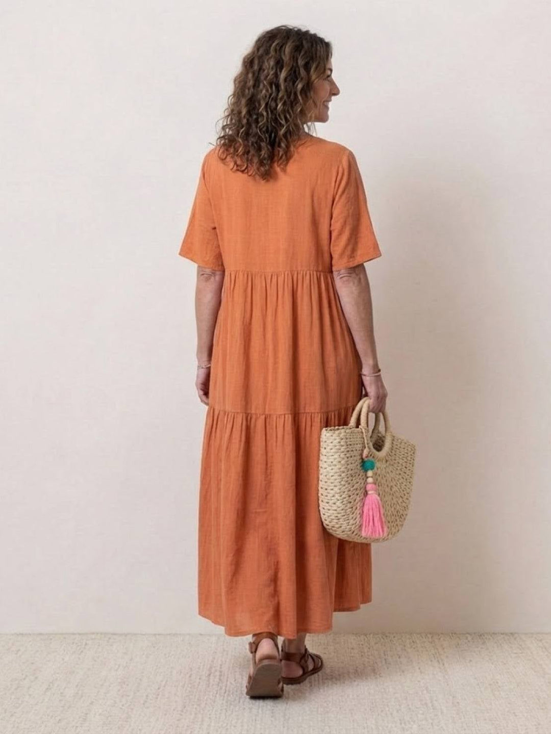 Front view of Sienna V-neck tiered maxi dress in apricot