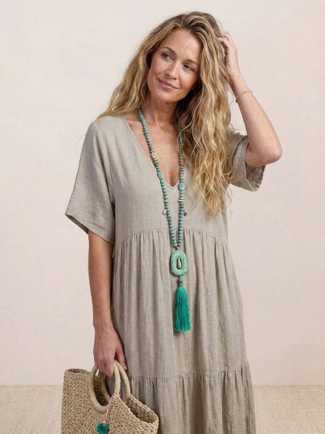 Lifestyle photo of Sienna swing maxi dress in black styled with heels