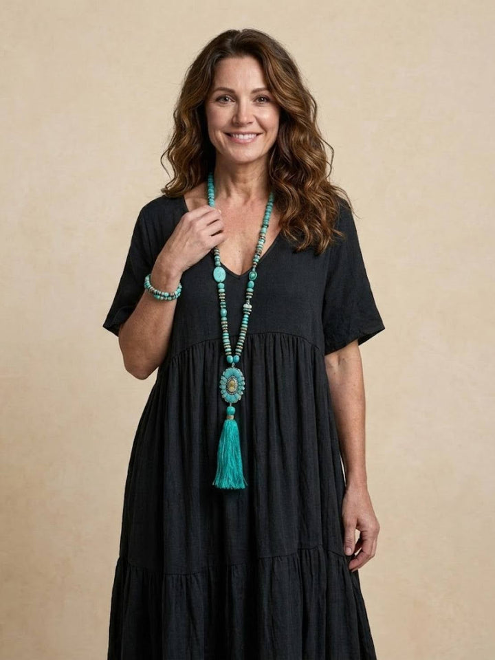Side profile of Sienna tiered maxi dress in navy blue