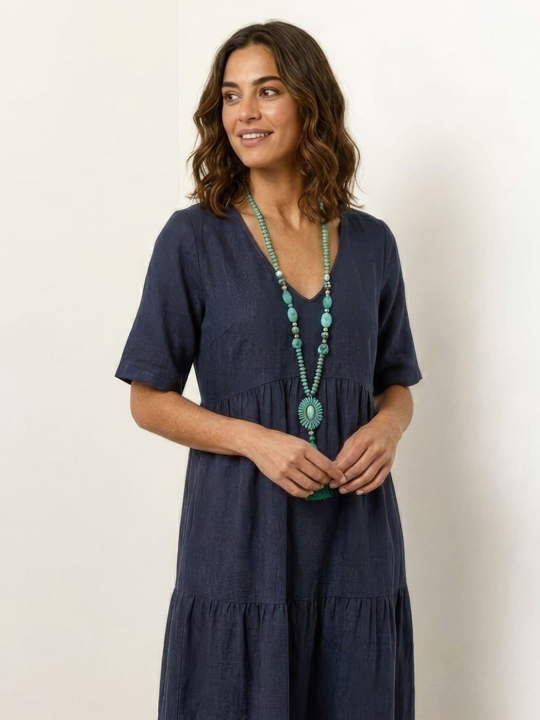 Close-up of short sleeves and tiered skirt on Sienna maxi dress in red