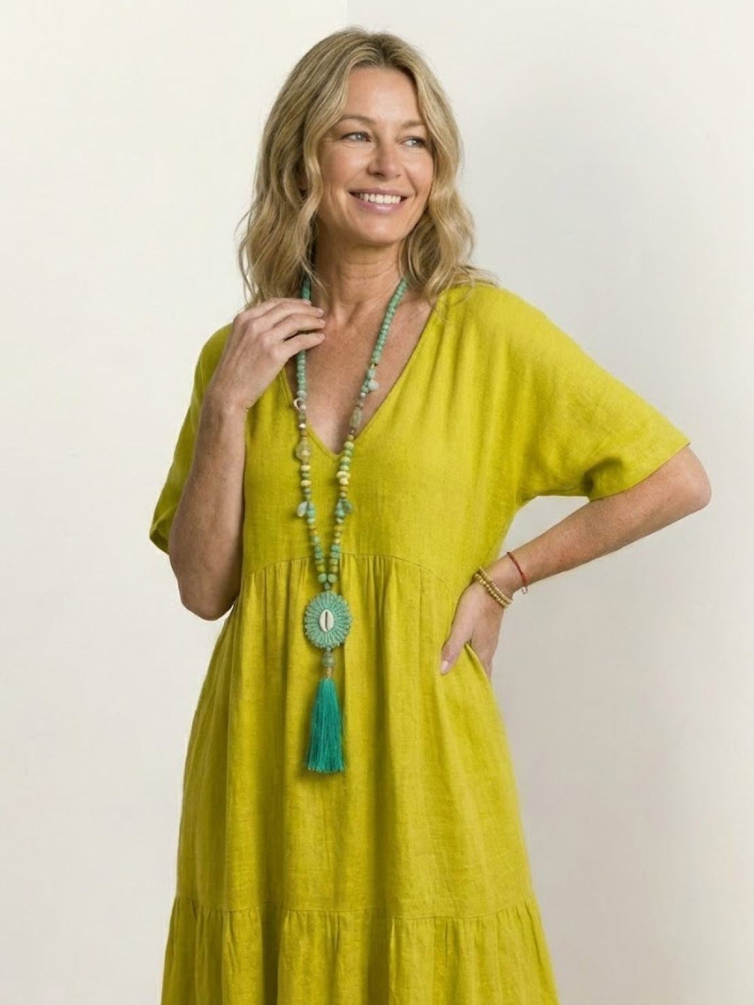 Full-length lifestyle shot of Sienna tiered maxi dress in yellow styled for summer