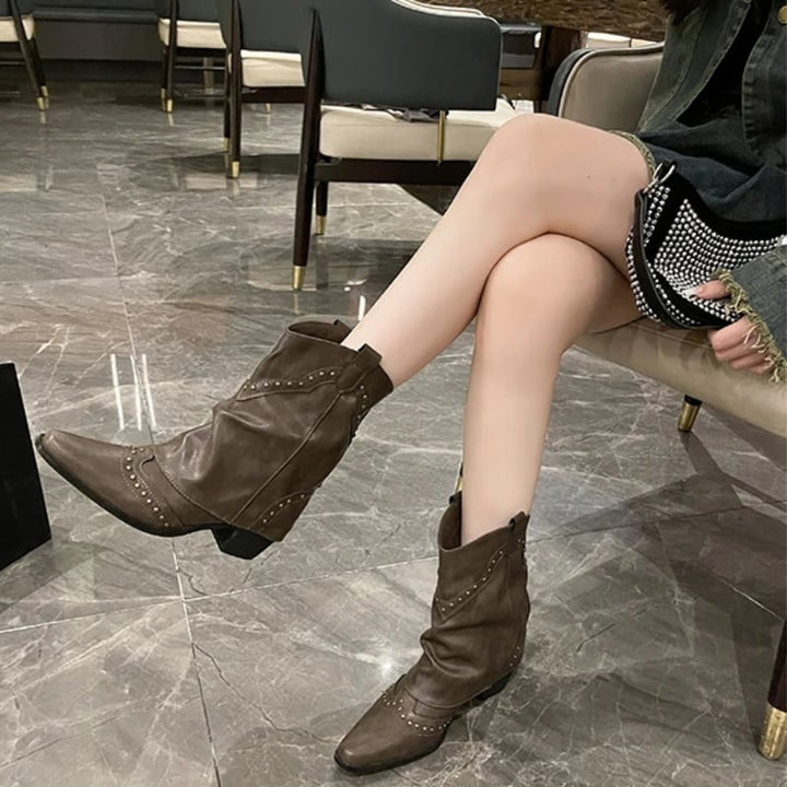 Front view of black Sierra studded western boots with metallic rivet details and mid heel