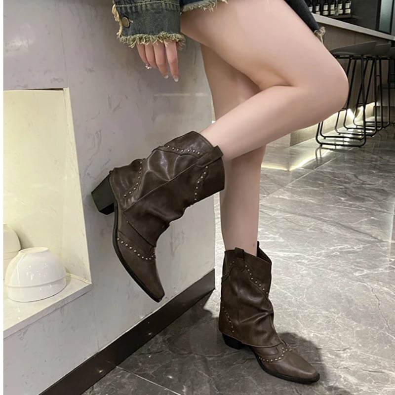 Side profile of black Sierra studded western boots showing western silhouette and stud accents