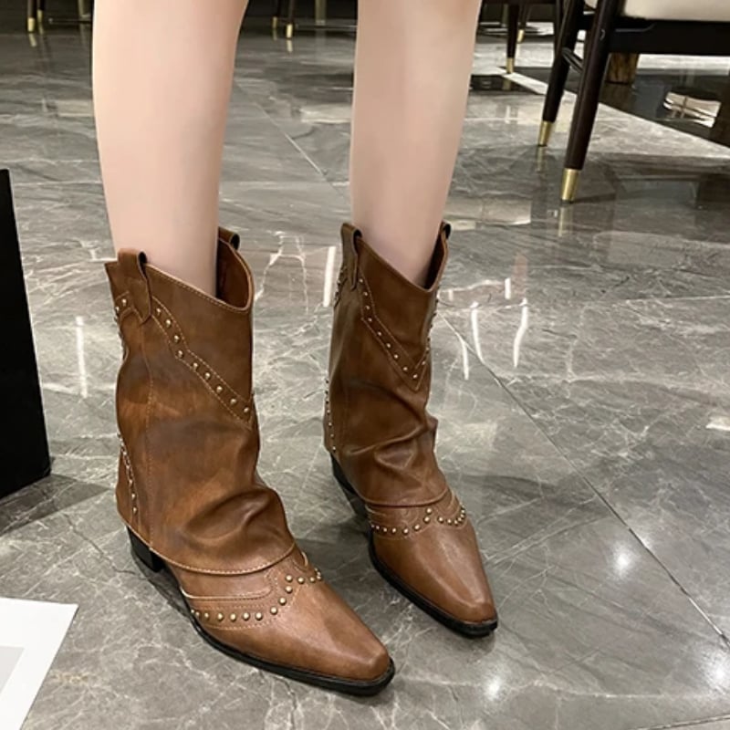 Black Sierra boots angled three-quarter view highlighting stud pattern