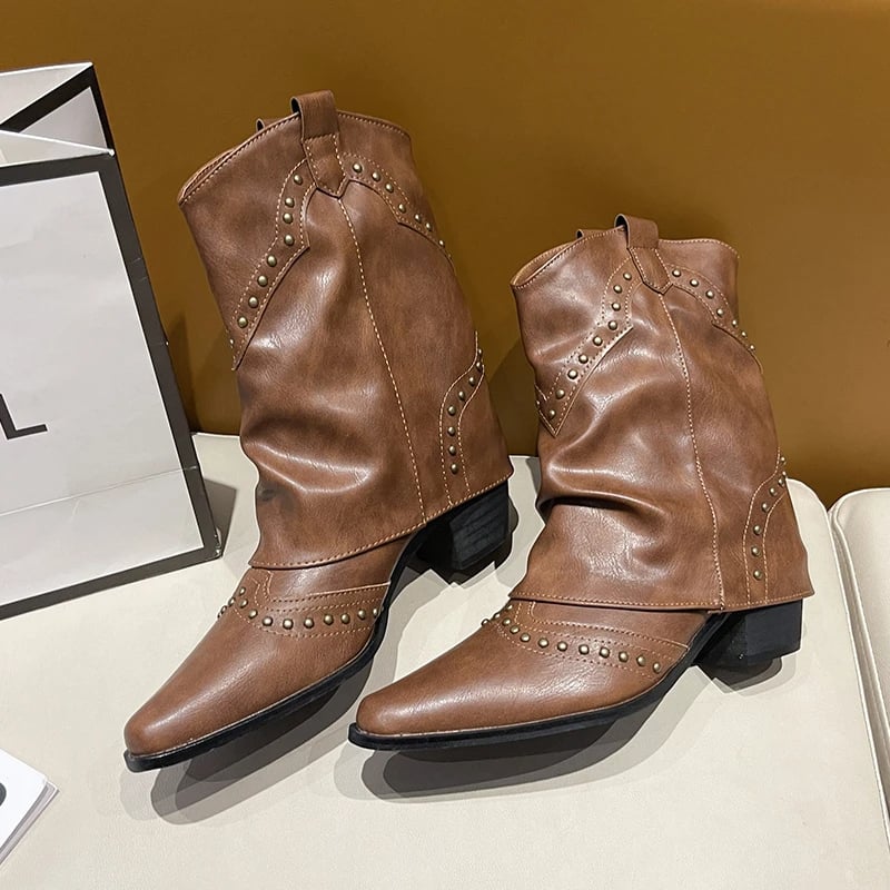 Woman sitting with black Sierra studded western boots crossed at ankle
