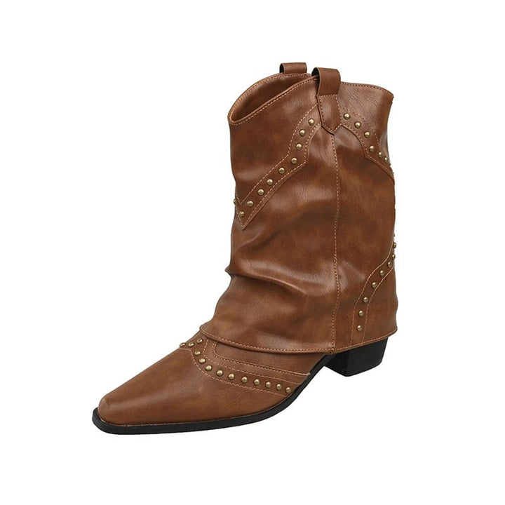 Lifestyle flat lay of black Sierra western boots with denim and accessories