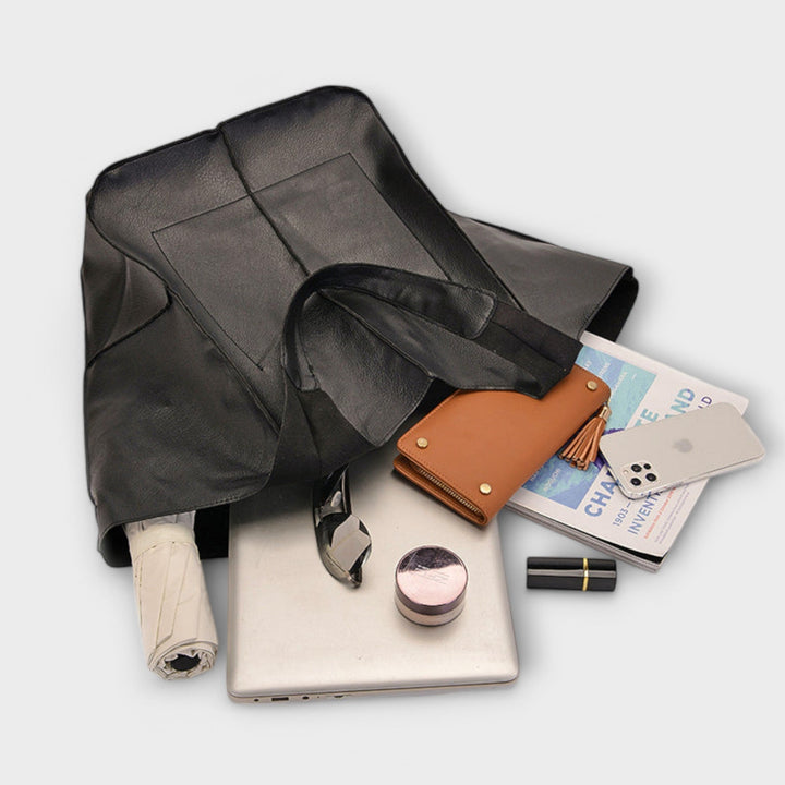 Sigrid Everyday Bag in red shown at a slight angle highlighting its sleek minimalist design