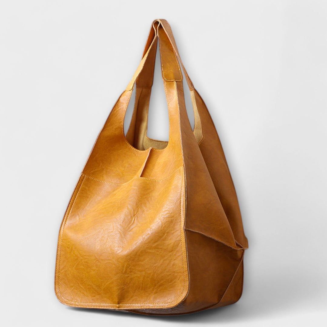 Detail shot of the Sigrid Everyday Bag handle stitching and hardware