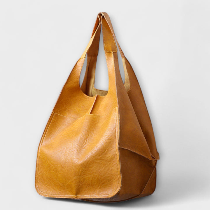 Detail shot of the Sigrid Everyday Bag handle stitching and hardware