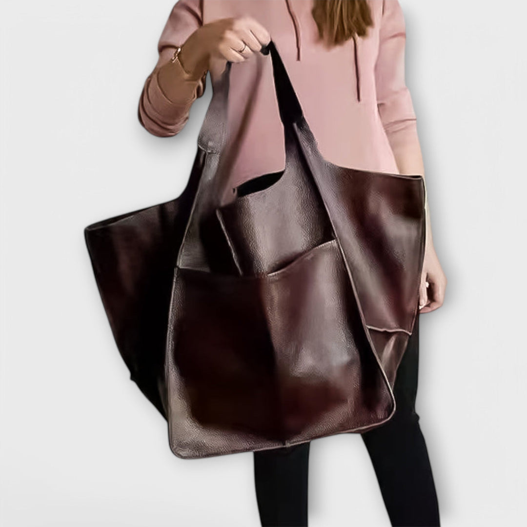 Sigrid Everyday Bag in black carried over the shoulder showing everyday wearability