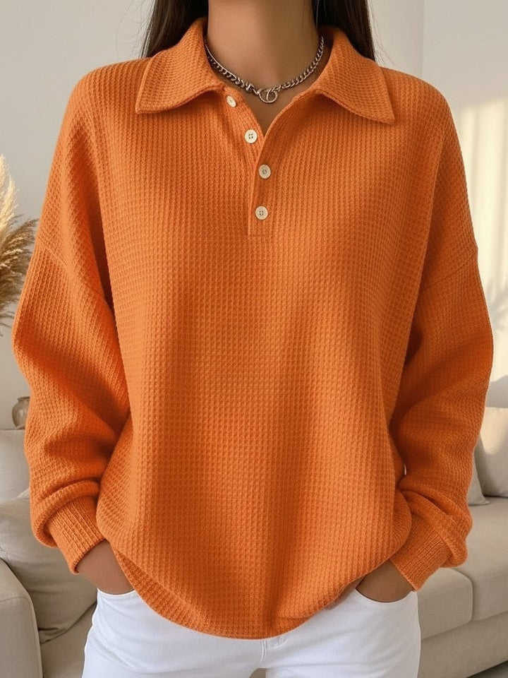 Model styled in the Sky textured polo sweater paired with casual bottoms, side view