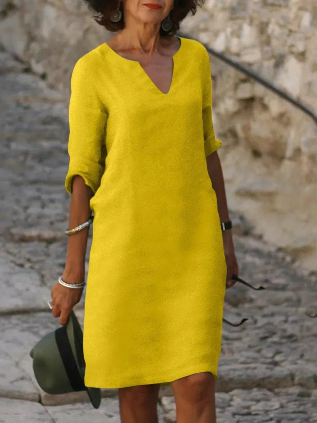 Yellow elegant V-neck dress showing inclusive fit across a range of sizes
