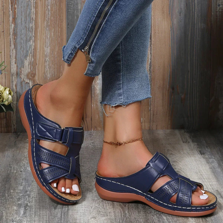 Skylark wedge sandals in dark blue displayed flat on white background