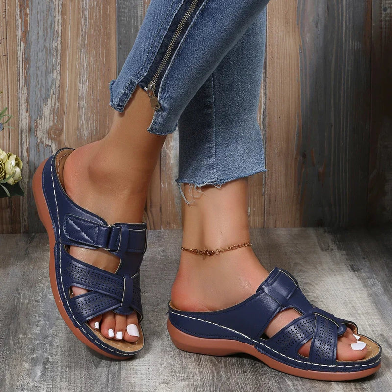 Skylark wedge sandals in dark blue displayed flat on white background
