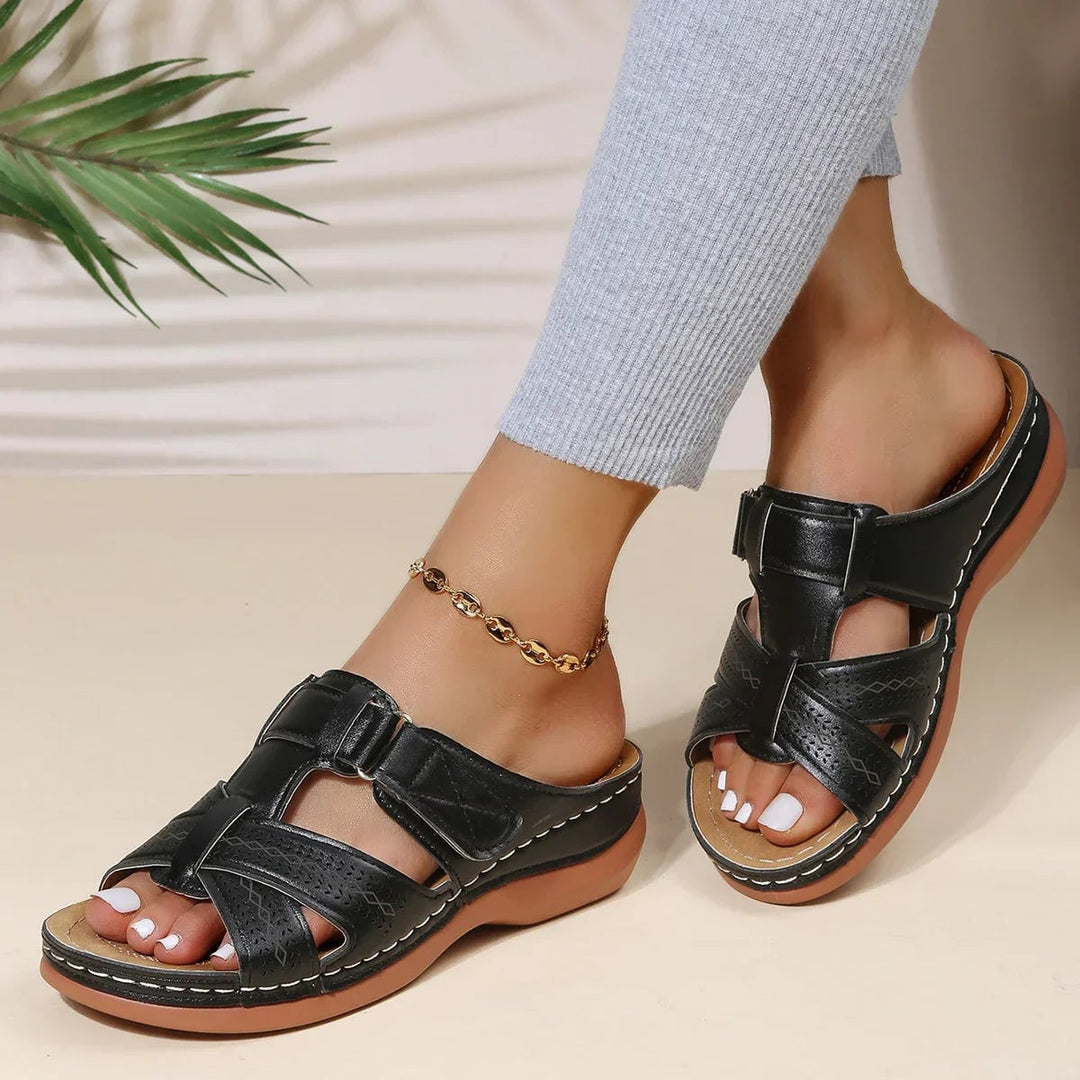 Skylark orthopedic wedge sandals styled with a floral midi dress on model