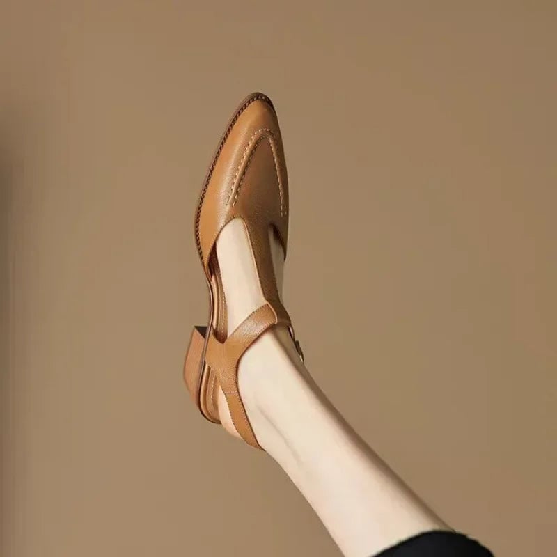 Sloane T-strap buckle flat in apricot showing wide strap and low sculpted heel, side profile