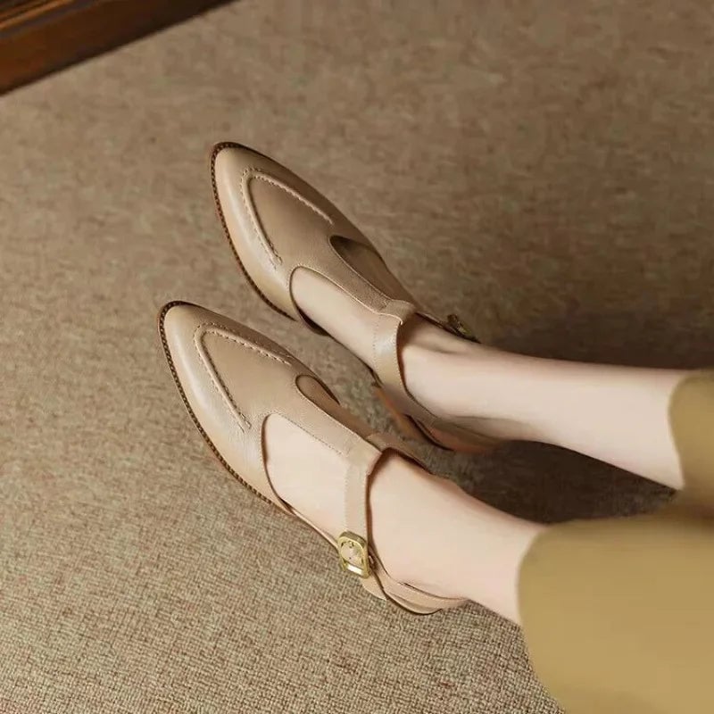 Overhead flat lay of both Sloane T-strap colorways — light brown and apricot — side by side