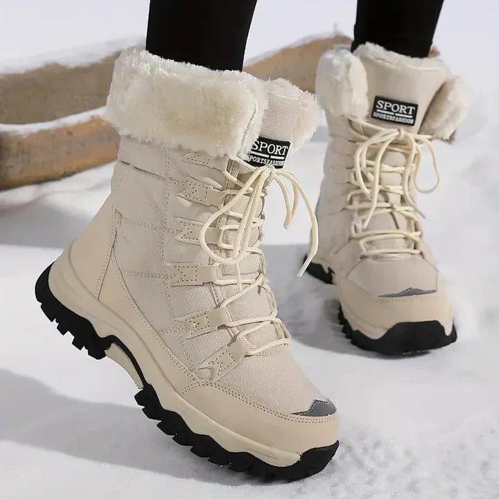 Close-up of SnowLuxe waterproof winter boots in a neutral colorway showing weatherproof exterior and rugged outsole