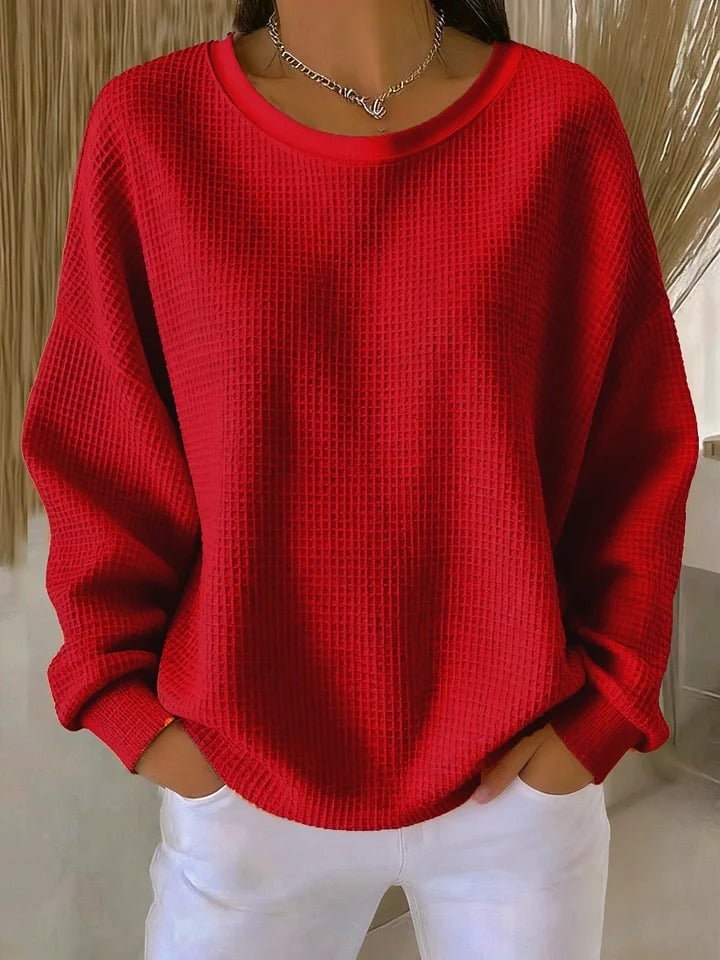 Close-up side view of the Sofia textured knit sweater highlighting the breathable knit fabric texture and cuff detail