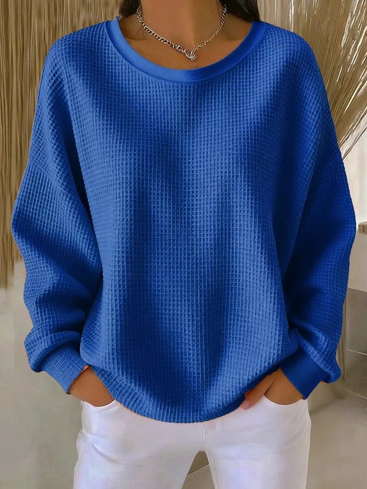 Sofia textured knit sweater in apricot displayed on a model, emphasizing the flattering drape and garment length