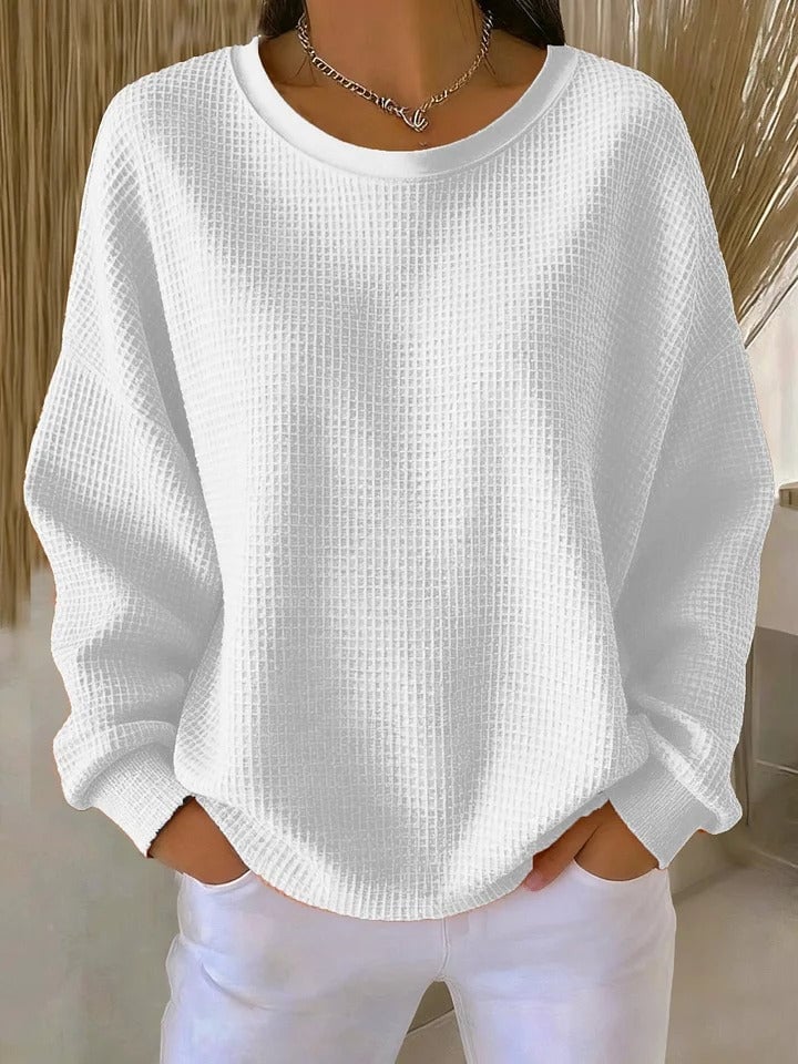 Front detail shot of the Sofia textured knit sweater in white showcasing the unique knit texture pattern