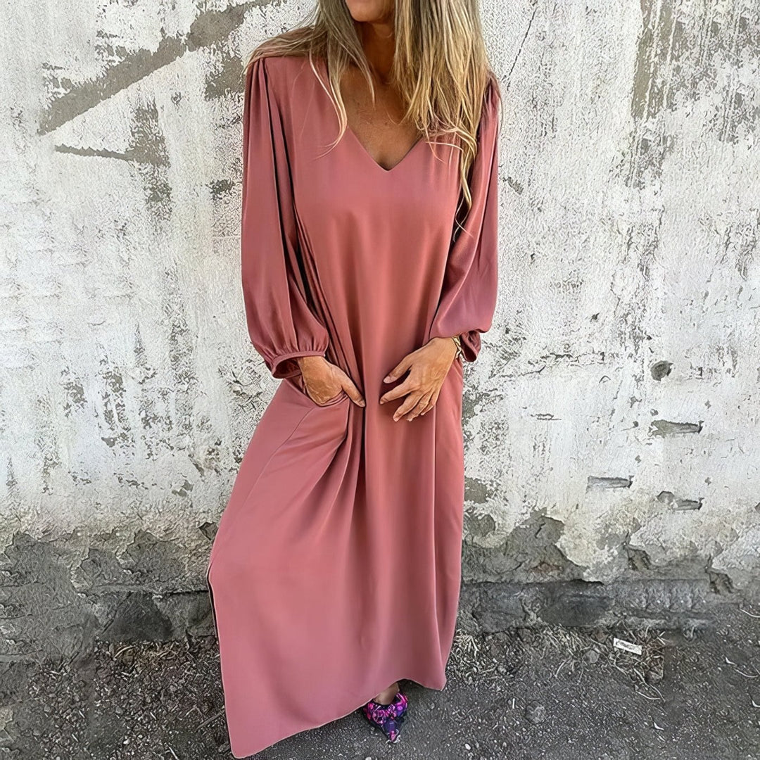 Full-length view of a breathable flowing maxi dress with discreet side pockets