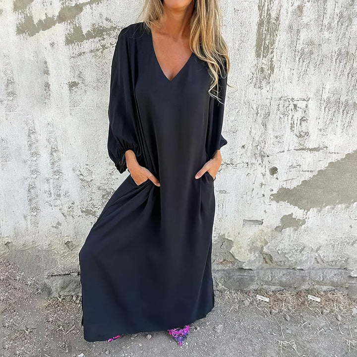 Woman styled in a flowing maxi dress with sandals for a relaxed summer look