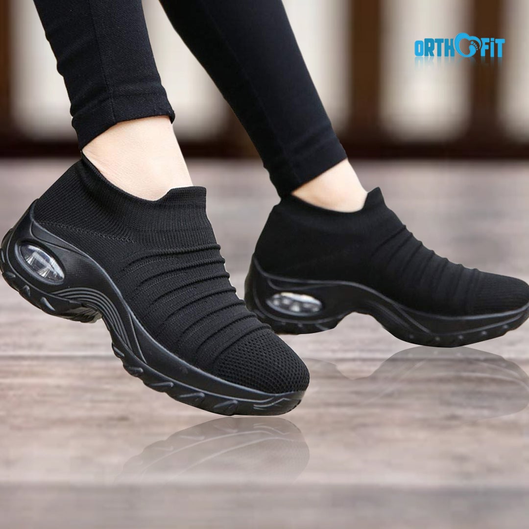 Solange women's arch support shoes in black with gray sole, side view on white background