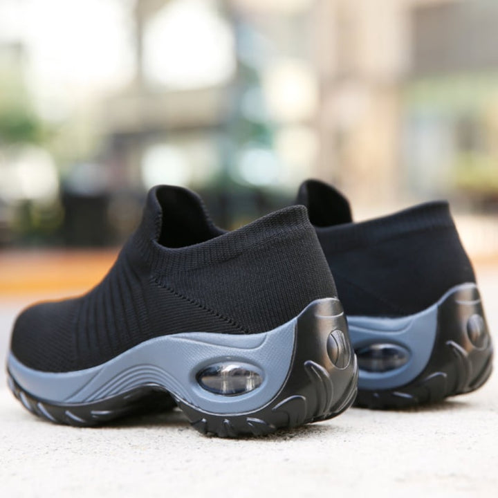 Solange black with colored stripes arch support shoes, close-up of stripe detail
