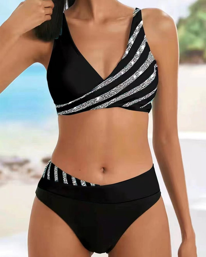 Close-up of the Solange bikini set fabric detail highlighting the warm-toned sunset-inspired print