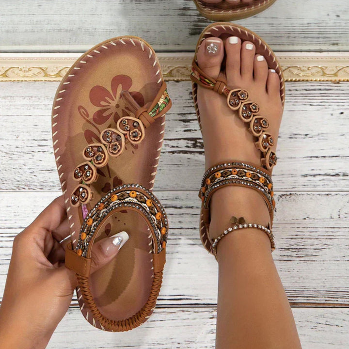 Solara boho beach sandals shown in a flat lay, highlighting the minimalist silhouette and intricate strap detailing