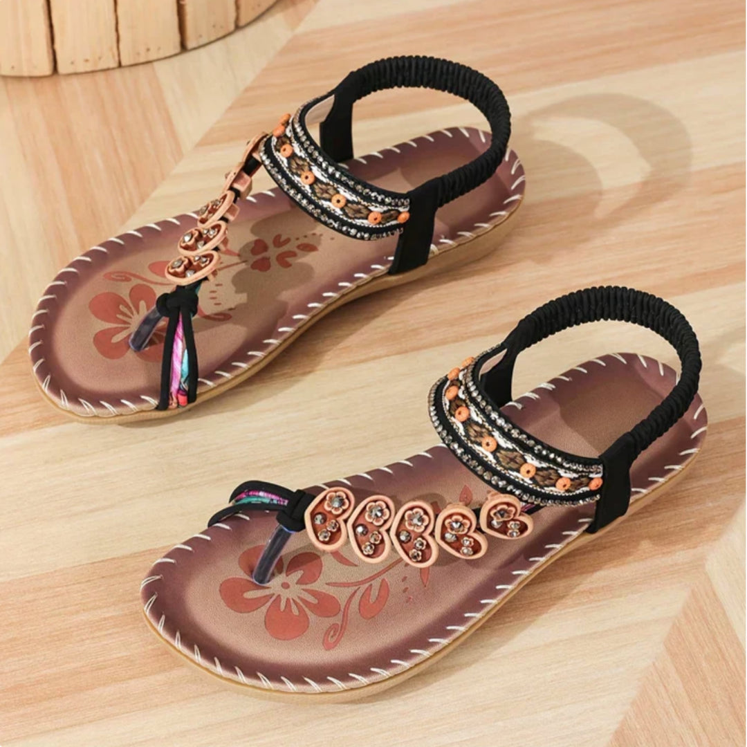 Solara sandals in black colorway showing clean minimalist silhouette