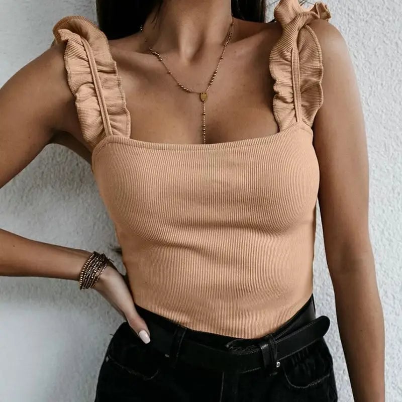 Ruffled summer top displayed in beige colorway showing the feminine silhouette and shoulder ruffle detail